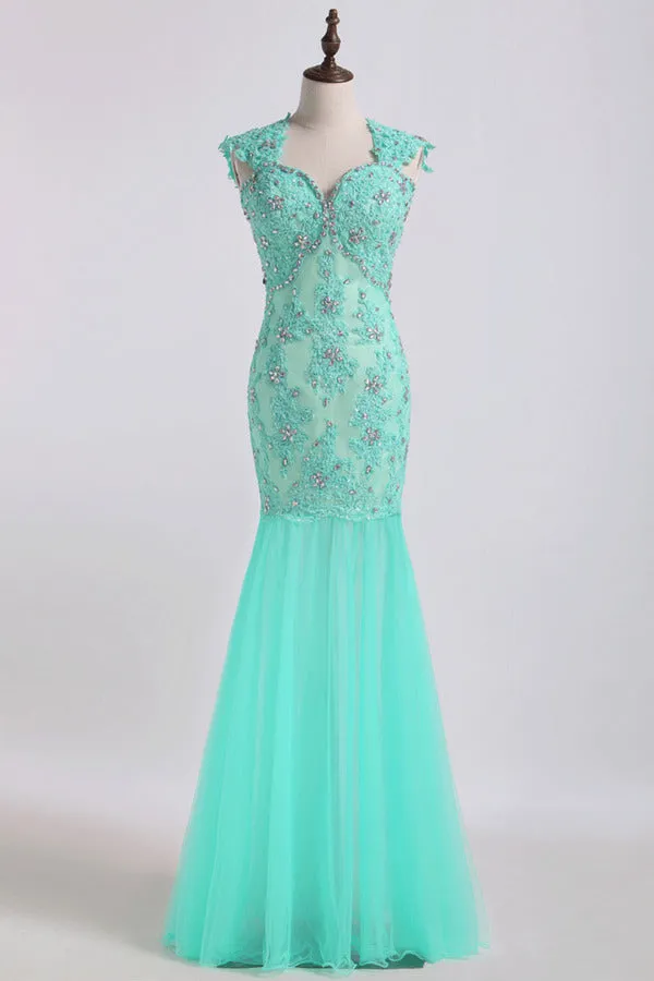 2024 Prom Dresses V Neck Mermaid/Trumpet Champagne With Applique&Beads Floor PPHXZ53Q