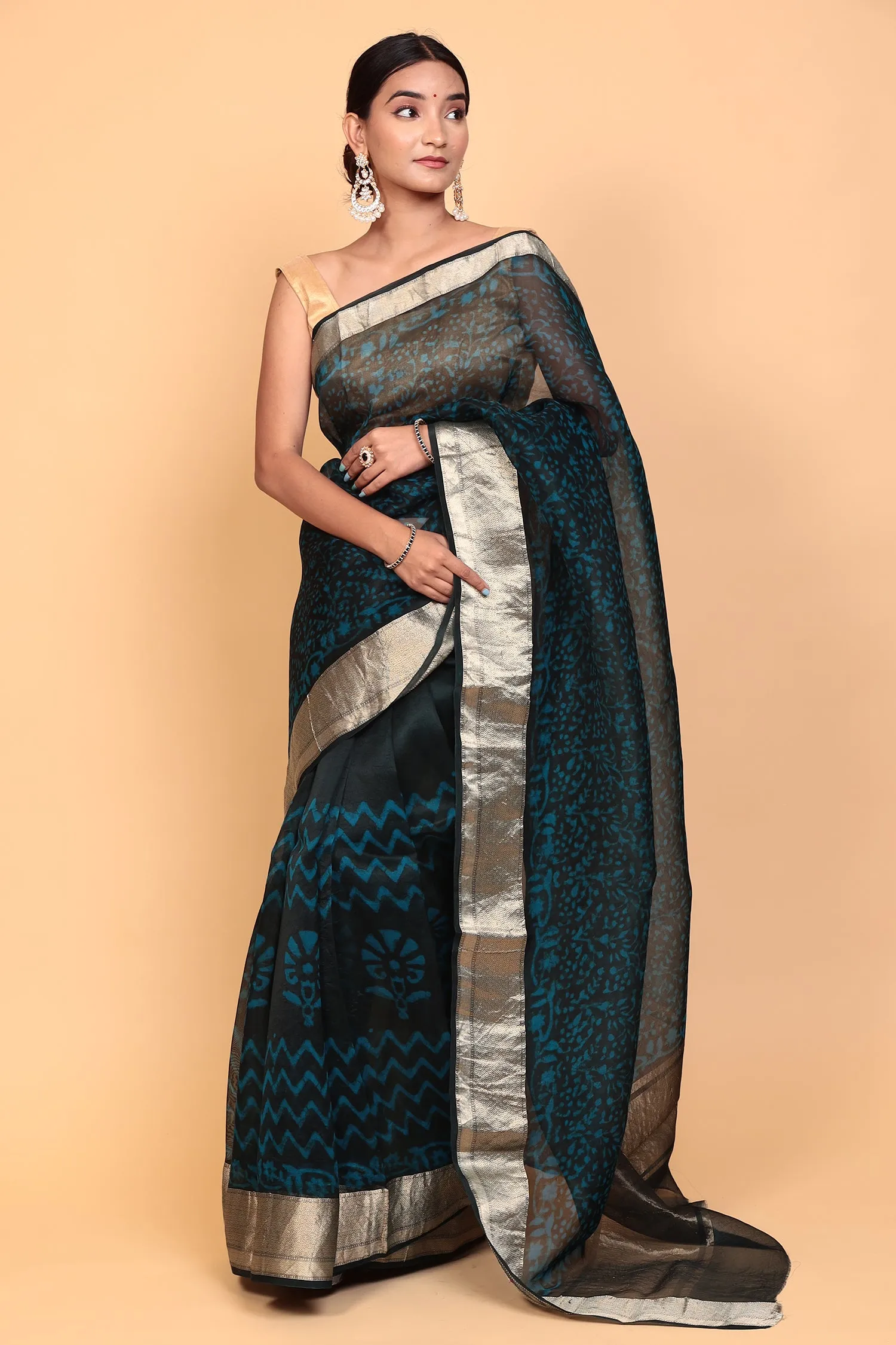 Dabu print Organza Saree with Zari work.